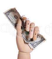 wooden hand holding dollars
