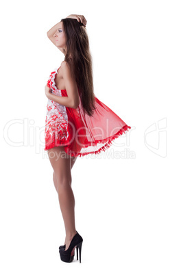 Pretty young girl posing in sexy red peignoir