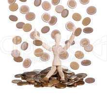 wooden doll sitting in rain of coins