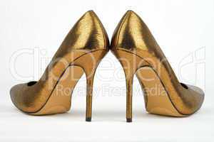 Pair of golden colored High Heel