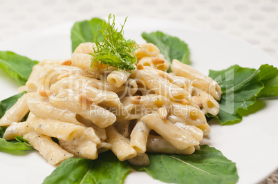 Italian pasta penne gorgonzola and pine nuts