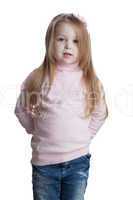 Little girl in sweater and jeans
