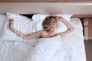 Beauty young woman relax bed in morning room