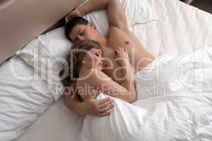 Young couple sleep in bed