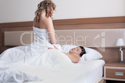 Young couple making love in bed