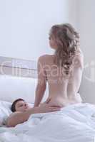 Couple making love in bed at morning