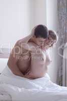 Couple making love in bedroom
