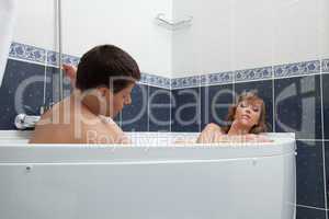 Sexy young couple relax in bathroom