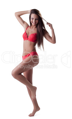 Happy beautiful young woman in red underwear