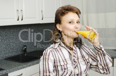 A woman with an orange juice