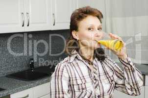 A woman with an orange juice