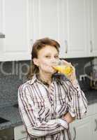 A woman with an orange juice