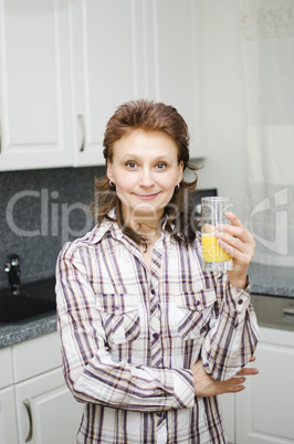 A woman with an orange juice
