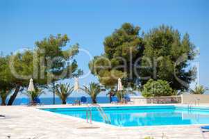 Swimming pool by a beach at the luxury hotel, Halkidiki, Greece