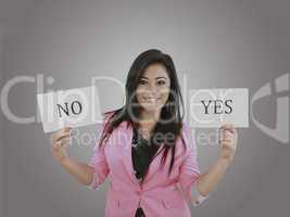 Business young woman trying to make a decision between Yes or No
