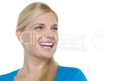 Snap shot of a woman laughing while looking away