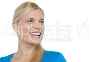 Snap shot of a woman laughing while looking away