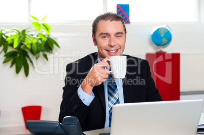 Boss enjoying hot coffee during work break