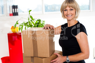 Blonde woman is ready to unpack her office stuff