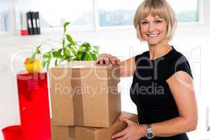 Blonde woman is ready to unpack her office stuff