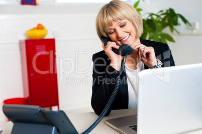 Secretary attending call before passing it to boss