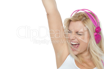 Woman enjoying loud music. Rock on
