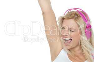 Woman enjoying loud music. Rock on