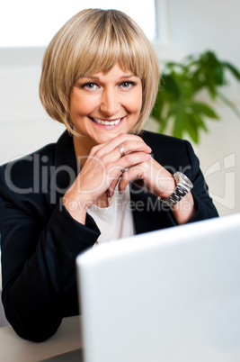Attractive blonde business executive posing