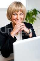 Attractive blonde business executive posing