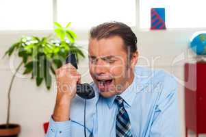 Businessman yelling during the phone call