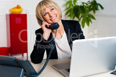 Cheerful lady engaged in a jovial conversation