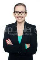 Bespectacled woman posing confidently