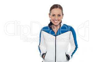 Woman in sporty jacket smiling warmly