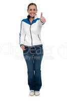 Casual charming woman gesturing thumbs up