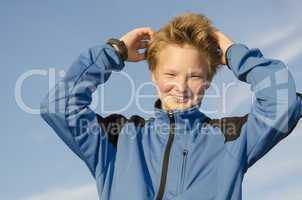 Kid adjusts his hair