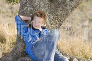 Teen under tree