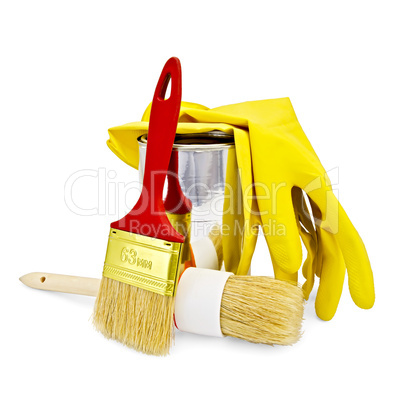 Brushes with yellow gloves and a jar