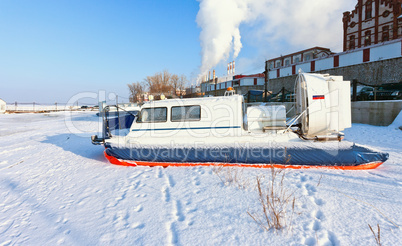 Hovercraft on the bank of a frozen river