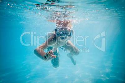 Boy swimming under water