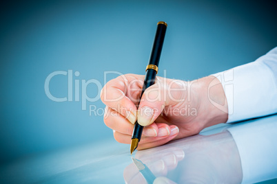 Woman's hand and pen