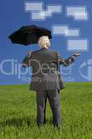 Businessman In Green Field Umbrella & Screens