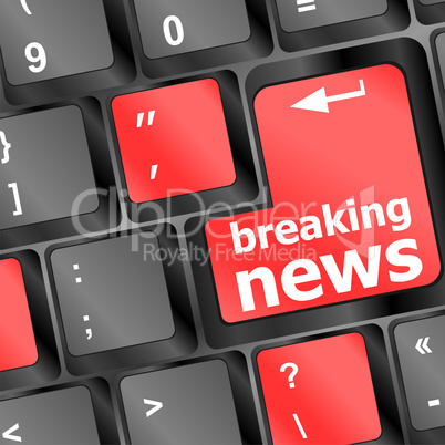 Button with breaking news text and letter symbols on the keyboard