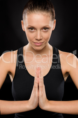 Portrait of smiling young woman performing yoga