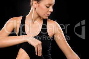 Brunette young woman in spine twisting pose