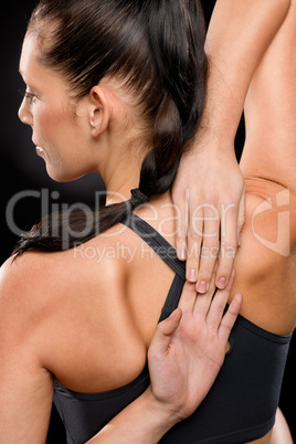 Young woman stretching her arms and back