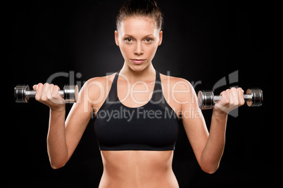 Portrait of a sporty woman lifting weights