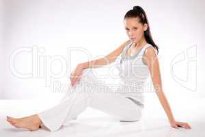Woman relaxing during training on white background