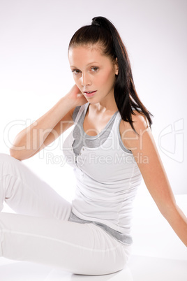 Woman thirsty after exercising on white background