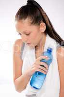 Woman thirsty after exercises holding water bottle