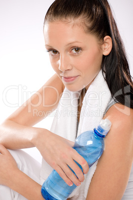 Young woman sitting with a water bottle